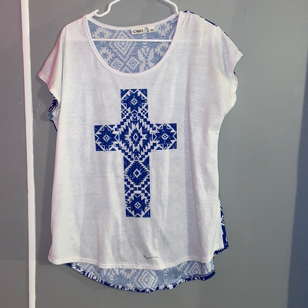 Women’s white and blue top with cross on the front. Size large